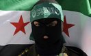 Akcja przeciwko Assadowi w Warszawie. Has�a na ambasadzie Syrii